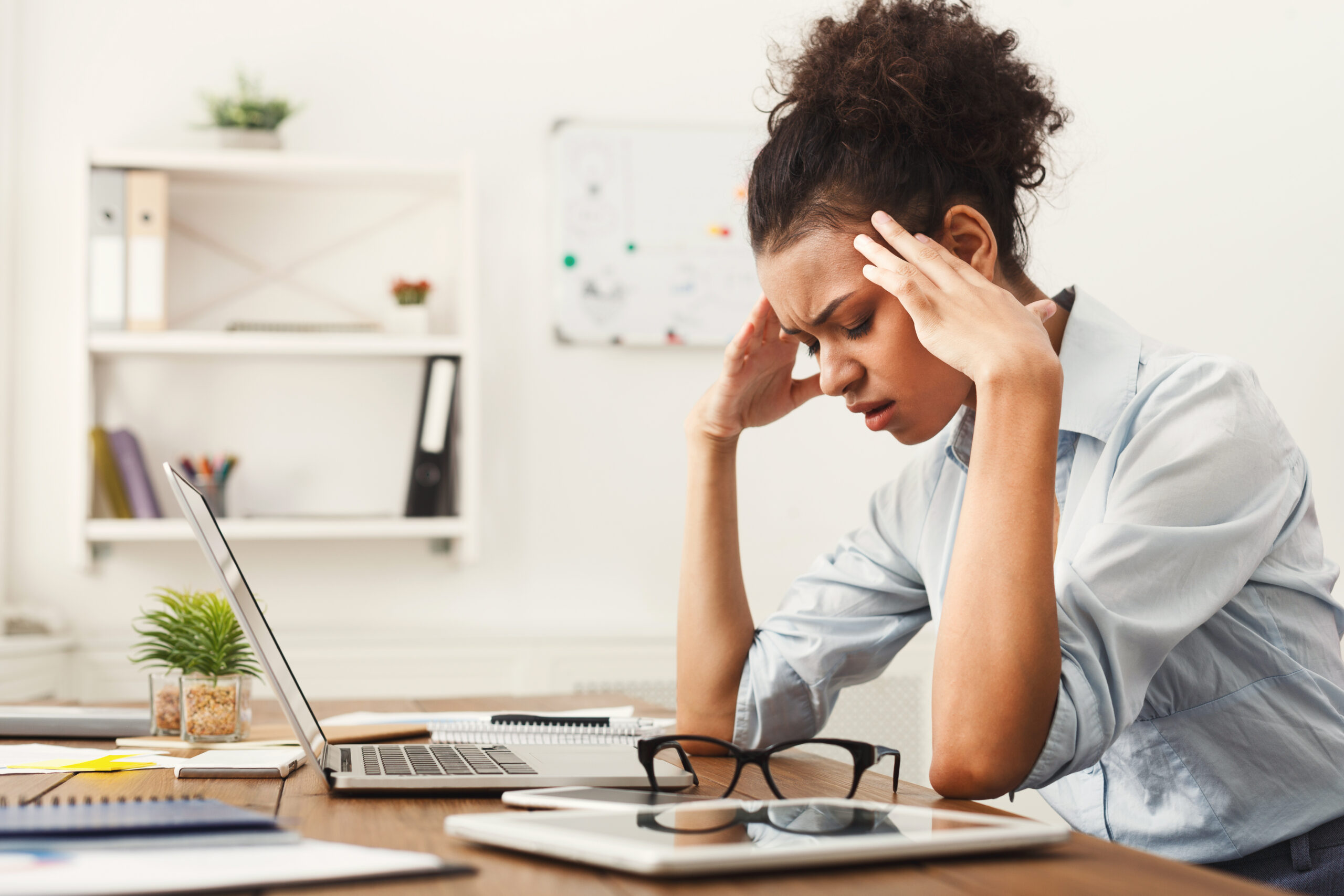 An employee shows sign of workplace stress. 